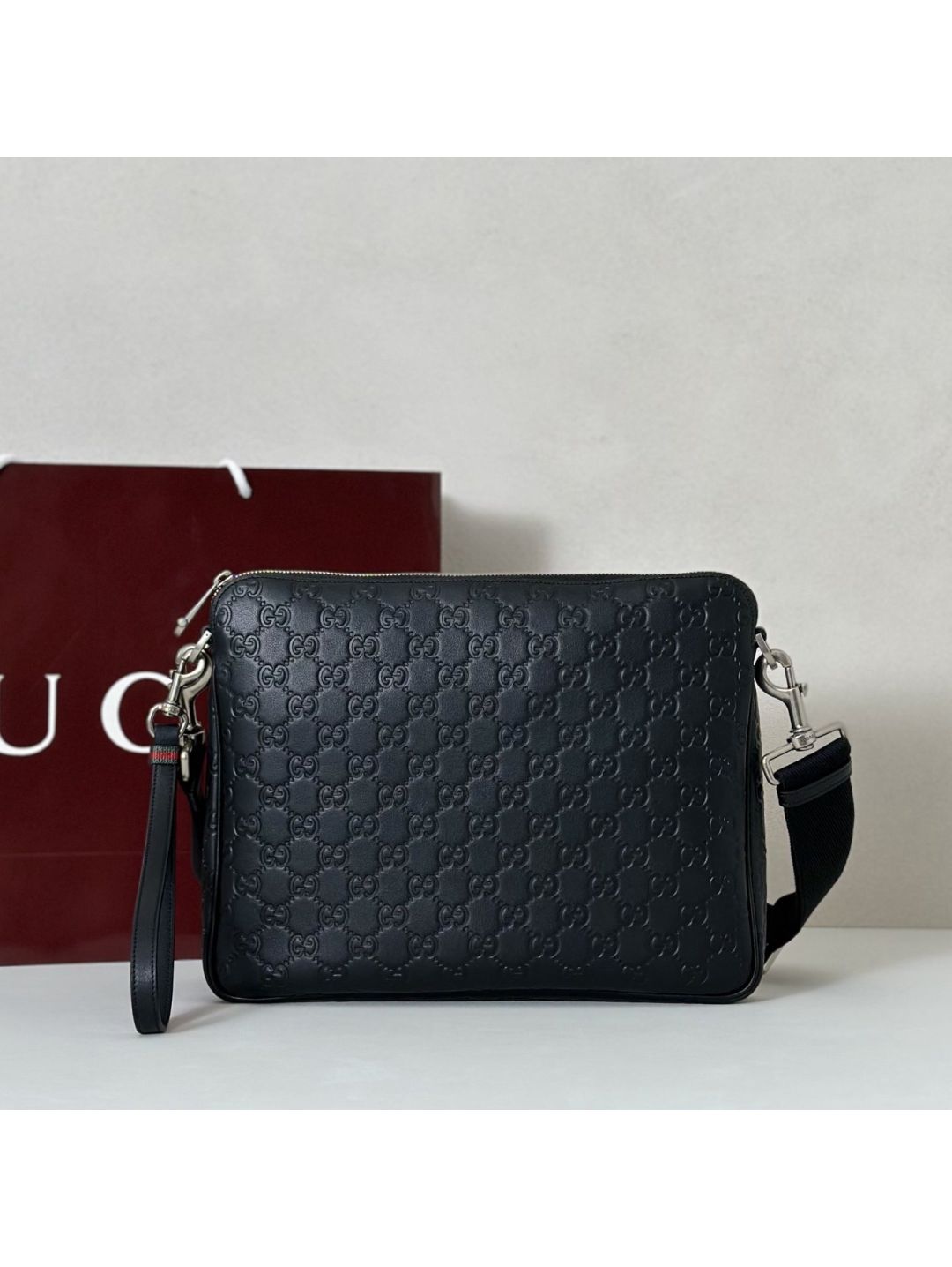 gg-embossed-crossbody-bag-in-black-rxgui292560-01