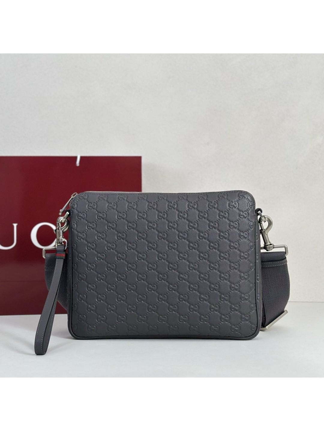 gg-embossed-crossbody-bag-in-grey-rxgui292536-01