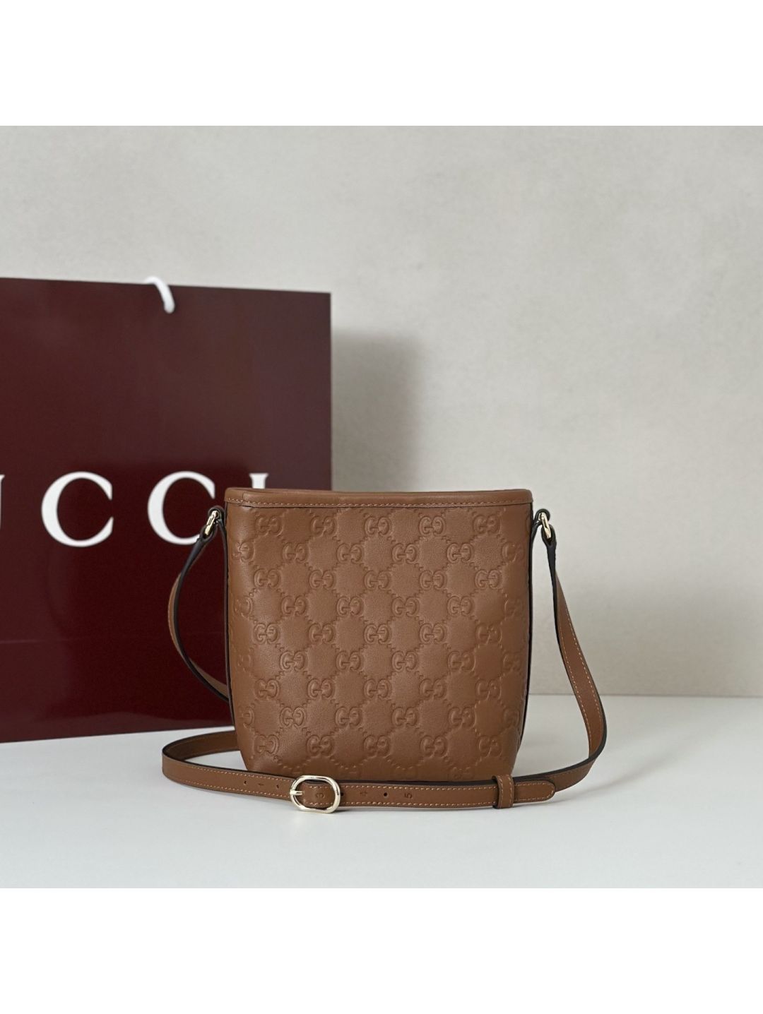 gg-embossed-crossbody-bag-in-tan-rxgui292540-03