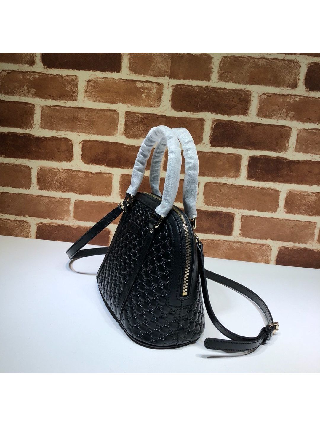 gg-embossed-dome-shoulder-bag-in-black-rxgui292556-02