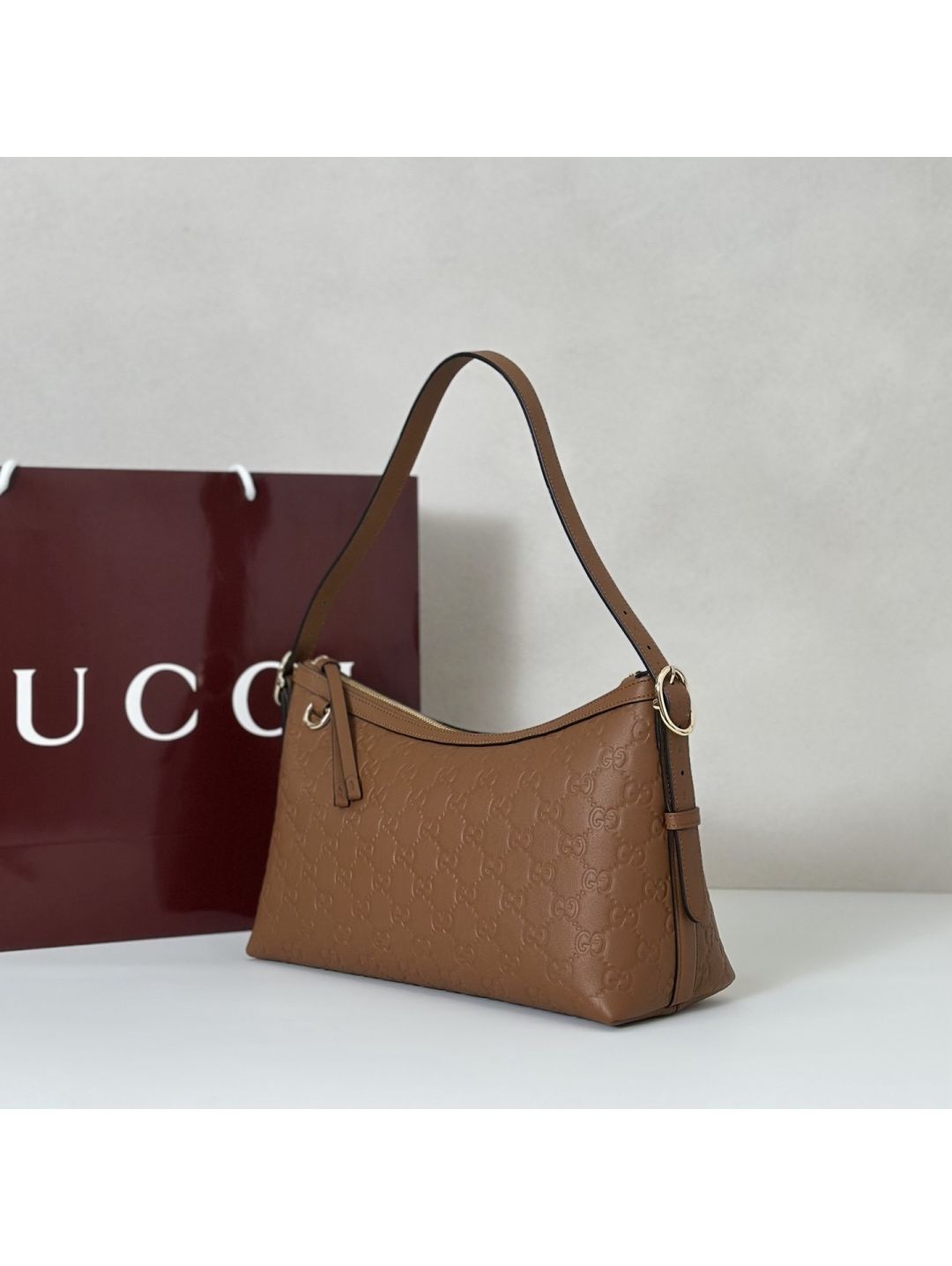 gg-embossed-shoulder-bag-in-tan-rxgui292404-02