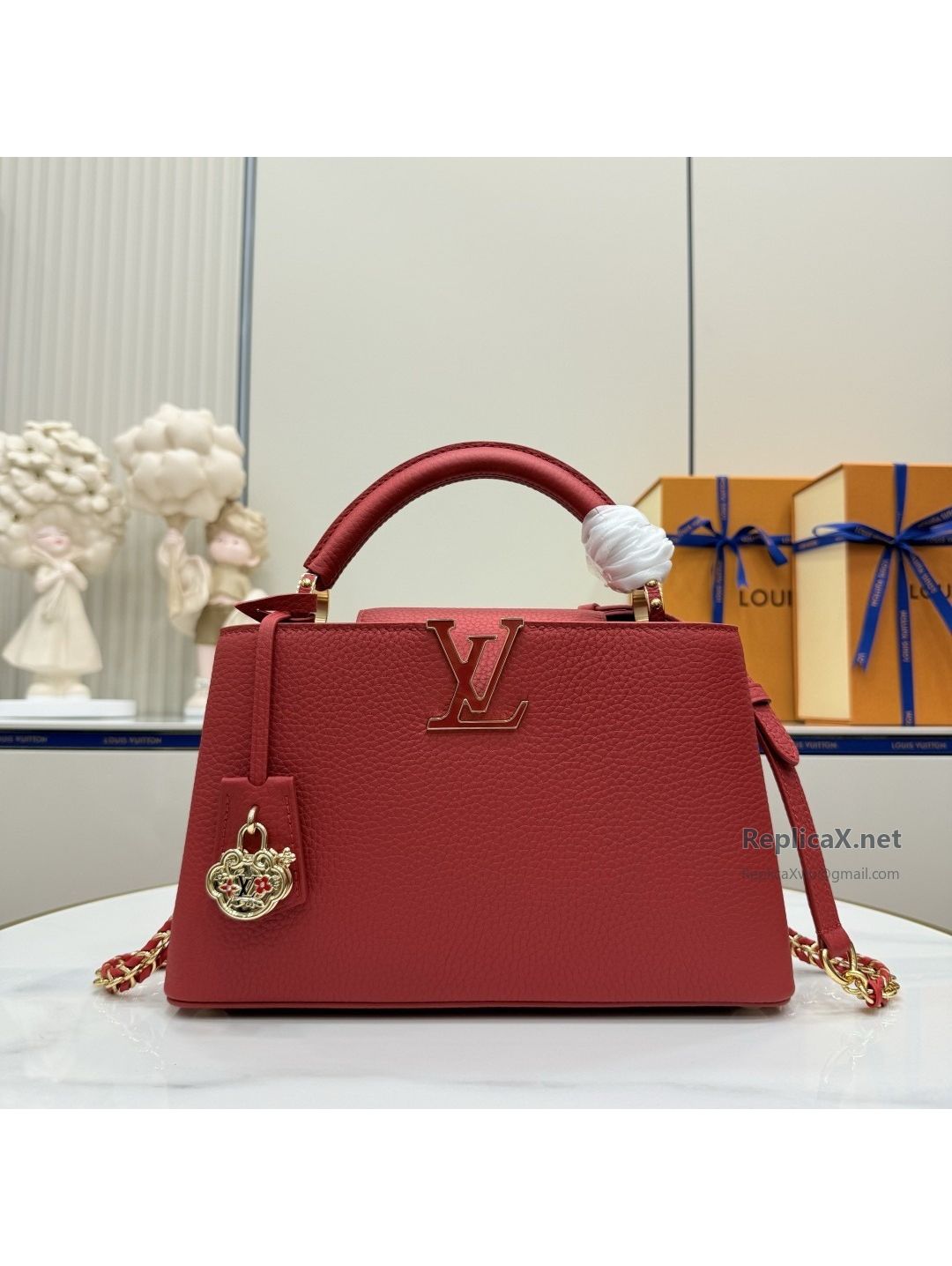 louis-vuitton-red-top-handle-bag-with-decorative-charm-rxlvj01696-01