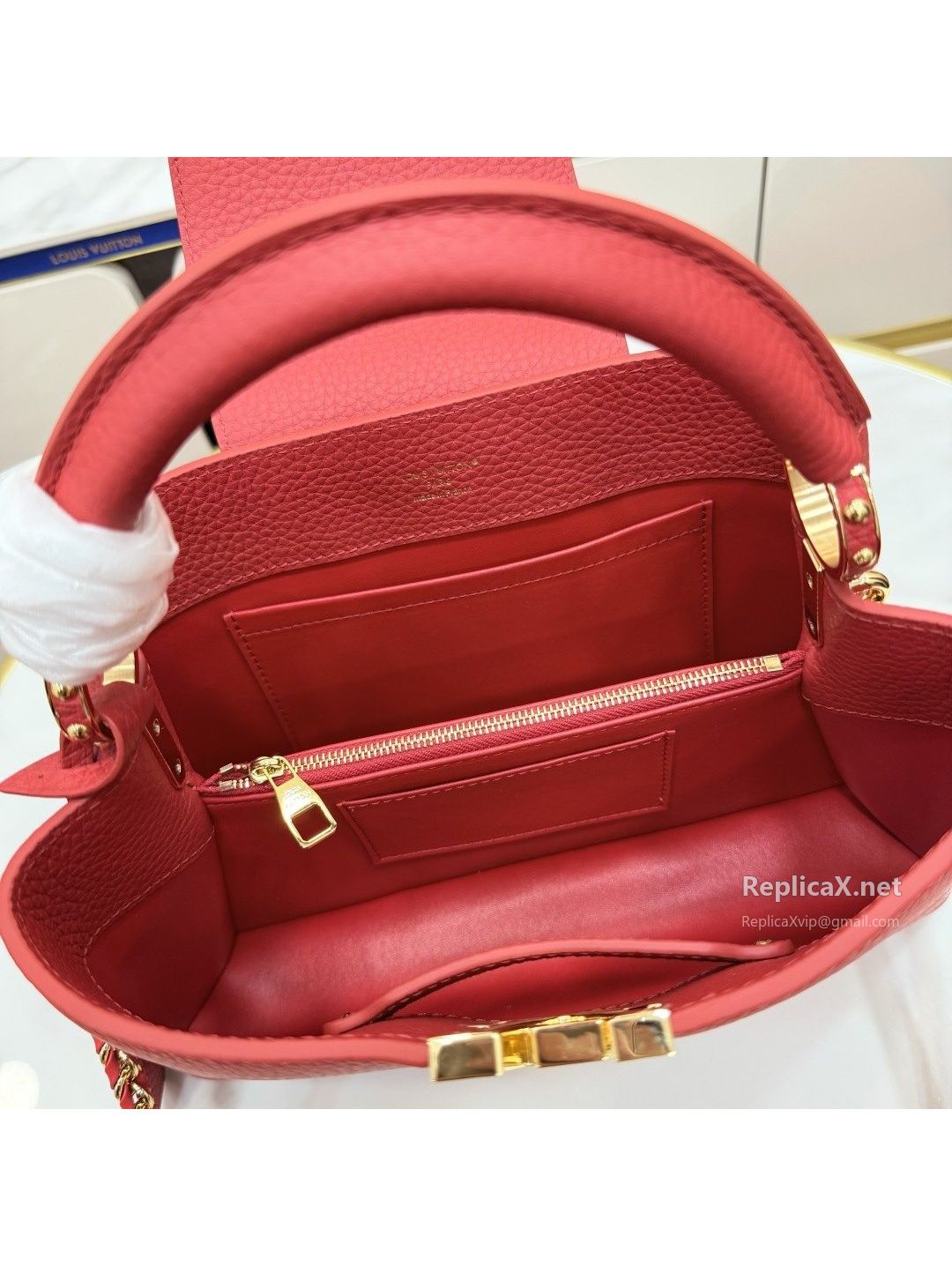 louis-vuitton-red-top-handle-bag-with-decorative-charm-rxlvj01696-02