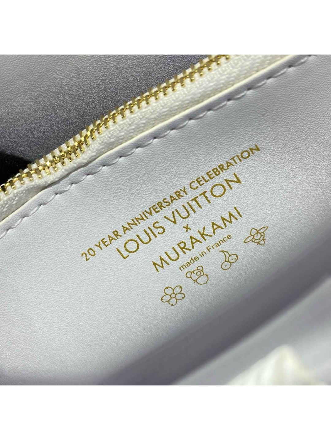 louis-vuitton-white-ribbed-turn-lock-bag-with-colorful-handle-rxlvj01314-02