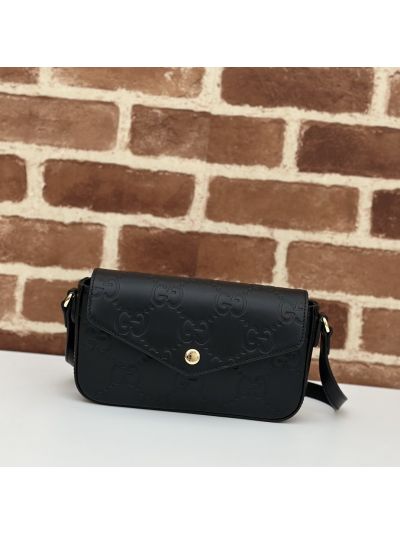 Gucci GG Embossed Flap Crossbody Bag in Black