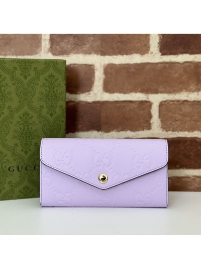 Gucci GG Embossed Wallet in Purple