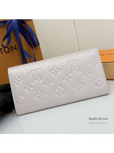 louis-vuitton-pale-pink-embossed-monogram-long-envelope-wallet-rxlvj01586-02