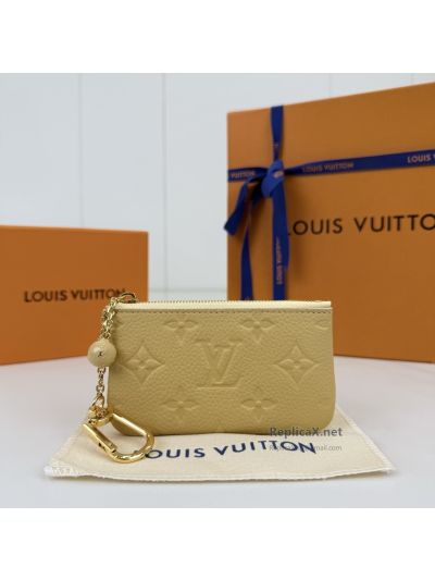 Louis Vuitton Pale Yellow Embossed Monogram Zip Key Pouch