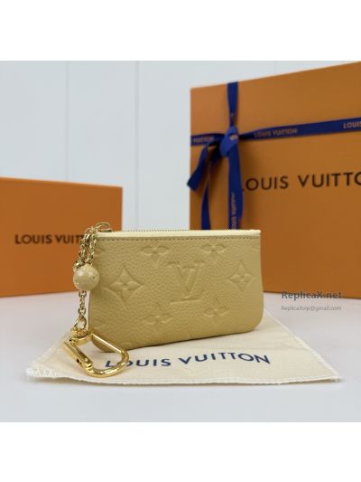 louis-vuitton-pale-yellow-embossed-monogram-zip-key-pouch-rxlvj01570-03