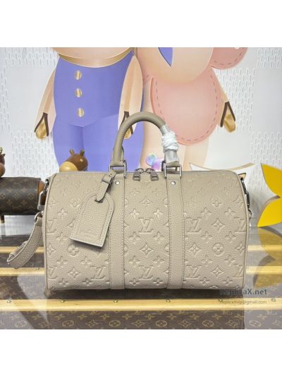 Louis Vuitton Taupe Embossed Monogram Duffle Bag