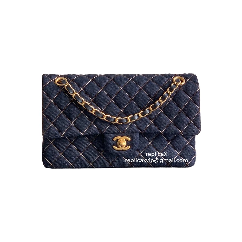 Front view of a dark blue denim Chanel Medium Flap shoulder bag with quilted structure and chain strap