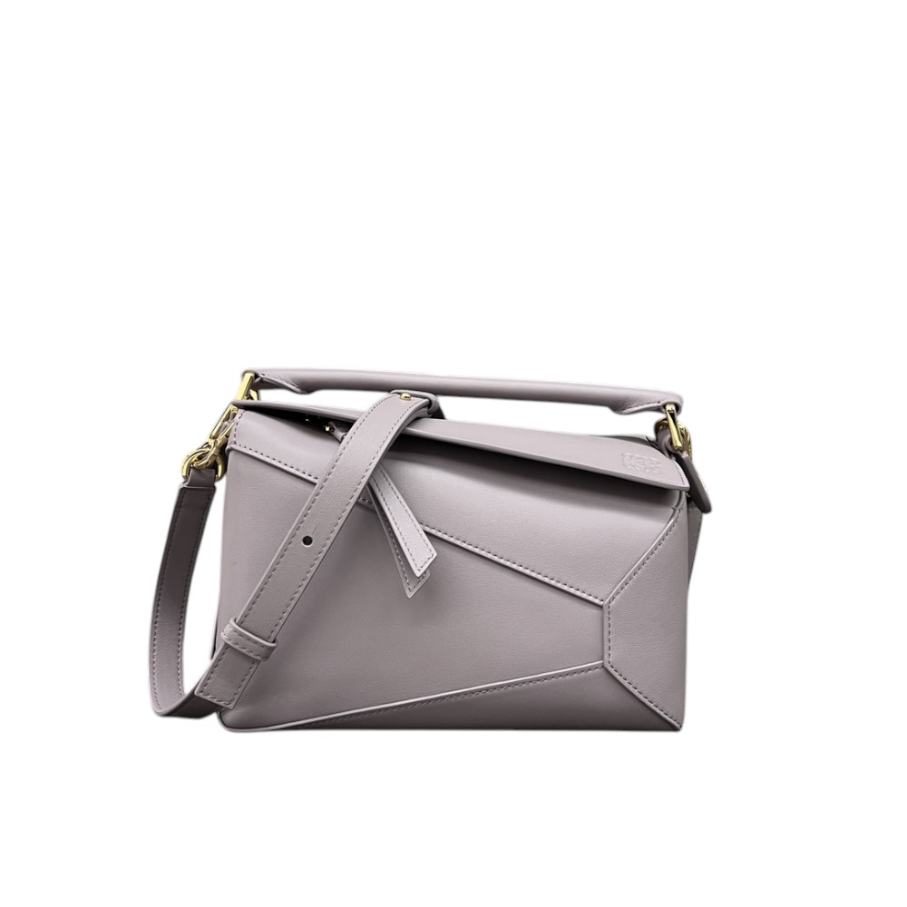 Front view of a light purple Loewe Small Puzzle crossbody bag with geometric panel construction