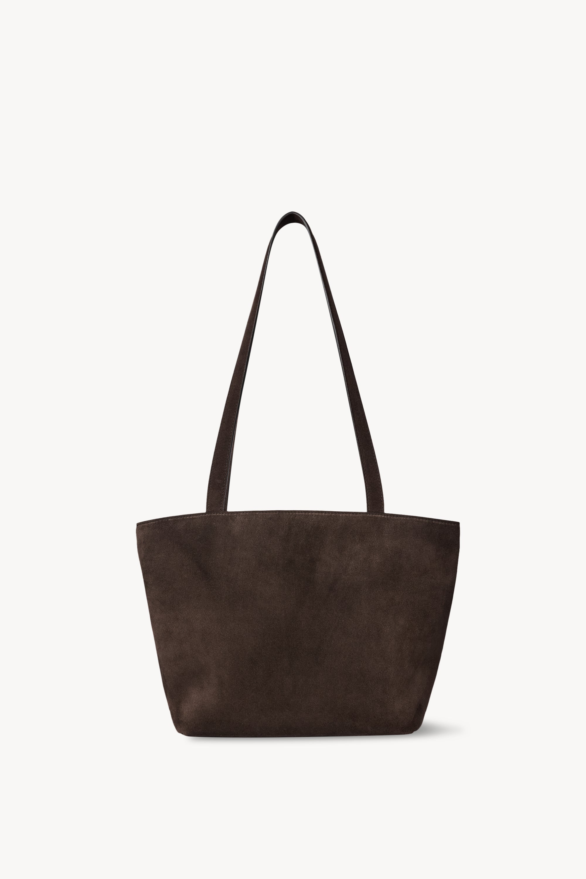 Dark brown The Row Parker Bag viewed from the front with long flat shoulder straps